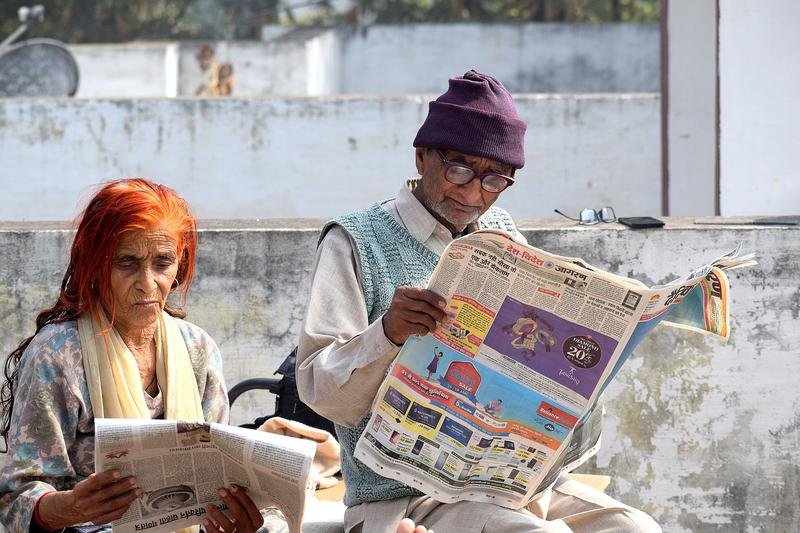 old couple, reading, newspaper