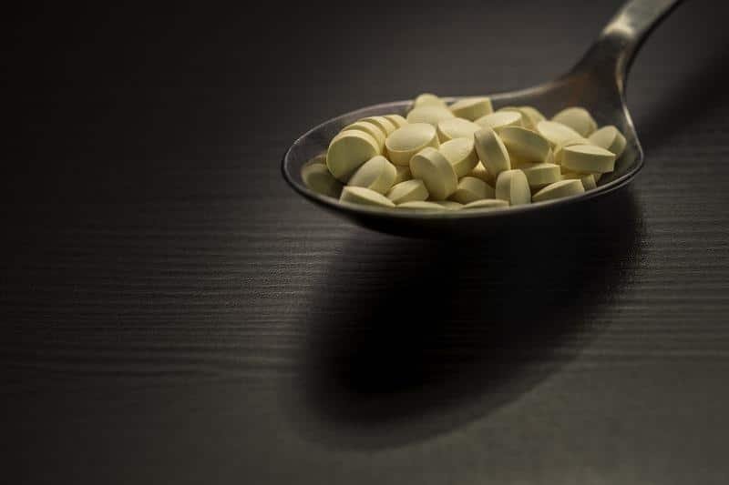 pills on a spoon, spoon, pills